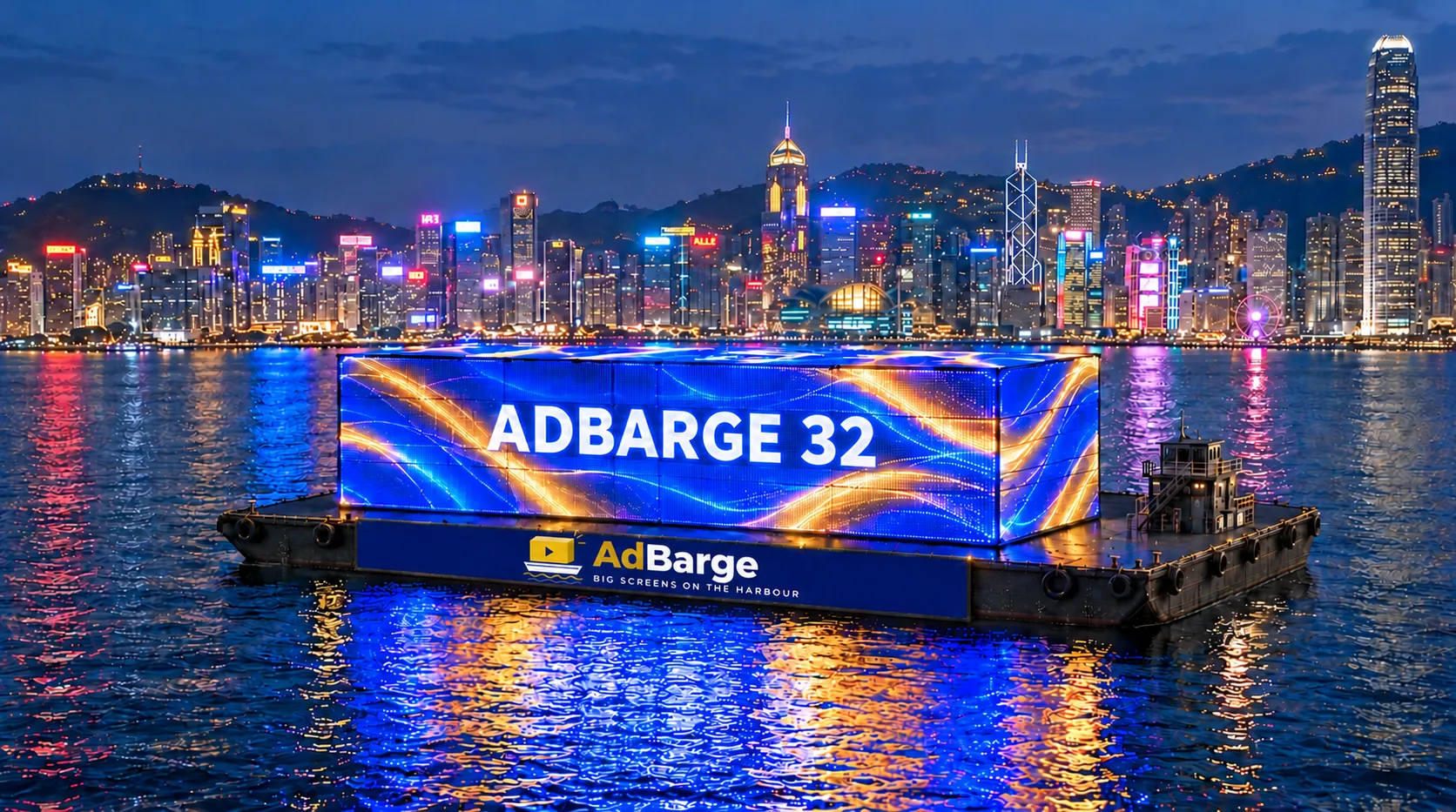 AdBarge, a floating LED stage with five giant screens, on Victoria Harbour at dusk